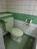 色合いがグリーンで統一された男性用トイレです